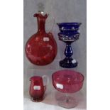 A VICTORIAN CRANBERRY GLASS CLARET JUG, a similar comport with jug and a blue lustre (4)