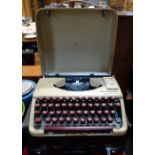 A VINTAGE 'CORONA' TYPEWRITER with case and an Olympia typewriter (2)