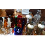 A COLLECTION OF GLASS BOTTLES