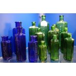 A COLLECTION OF VINTAGE GREEN AND BLUE GLASS POISON BOTTLES