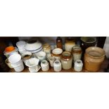 A COLLECTION OF STONEWARE STORAGE JARS, plant pots and ceramics