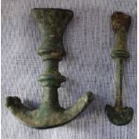 A LURISTAN BRONZE DAGGER HANDLE and a smaller bronze knife, circa 800-600BC