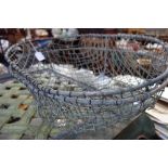 A PAIR OF VINTAGE WIRE POTATO BASKETS