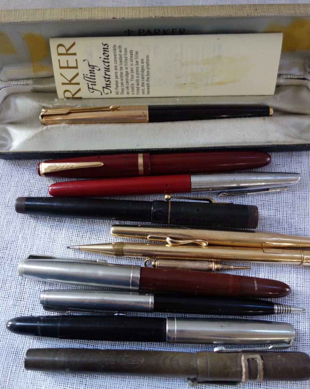 A VINTAGE PARKER INK PEN and a collection of similar pens