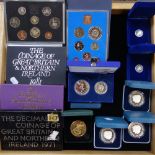 A POBJOY MINT ISLE OF MAN PROOF £1, ANOTHER, AND A COLLECTION OF ROYAL MINT PRESENTATION PACKS