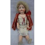 J.D.K GERMANY; AN EARLY 20TH CENTURY BISQUE HEADED DOLL, with glass eyes , composite body and limbs,