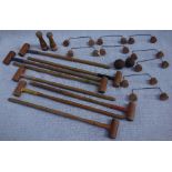 AN EARLY 20TH CENTURY WOODEN TOY CROQUET SET
