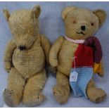 A VINTAGE PLUSH TEDDY BEAR with jointed limbs, 49cm high and another similar, 53cm high, both now in