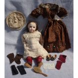 A VICTORIAN BISQUE HEADED DOLL, with glass eyes, bisque arms and kid leather legs, 36cm high, with