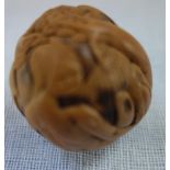 A JAPANESE MEIJI PERIOD CARVED NUT