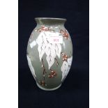 C.H. BRANNAM BARNSTAPLE; A SLIP DECORATED VASE, 24cm high