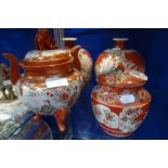 A PAIR OF JAPANESE KUTANI VASES decorated with warriors on a red ground, 18.5cm high and two similar