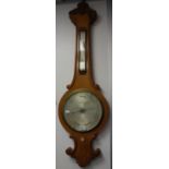 A VICTORIAN WHEEL BAROMETER by Negretti & Zambra with silver dial (examine)