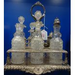 A 19TH CENTURY CUT GLASS CRUET with silver plated stand