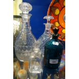 A REGENCY GREEN GLASS 'BRANDY' DECANTER and three decanters (4)