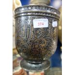 AN ISLAMIC WHITE METAL JARDINIERE, inlaid with brass on a black ground, 18.5cm high