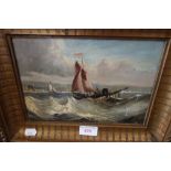 A 19TH CENTURY OIL ON CANVAS, seascape with boats in rough sea in gilt frame