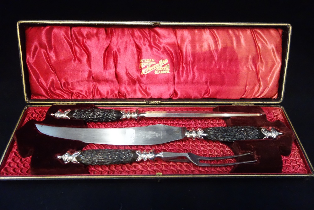 A THREE PIECE CARVING SET in a fitted presentation case