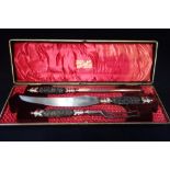A THREE PIECE CARVING SET in a fitted presentation case