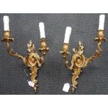 A PAIR OF ROCOCCO ORMOLU TWO BRANCH WALL LIGHTS