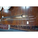 A REGENCY POLISHED STEEL TOASTING FORK and an iron toasting fork
