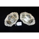 A PAIR OF PIERCED AND EMBOSSED SILVER BON BON DISHES, approx 3.80oz