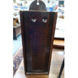 AN 19TH CENTURY OAK HANGING CANDLE BOX with sliding cover