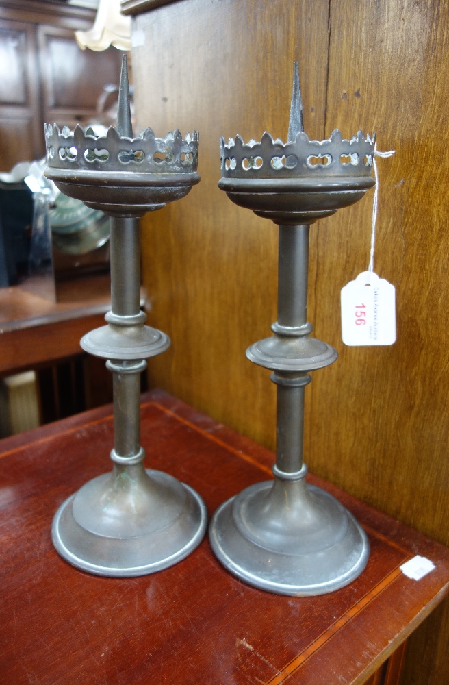 A PAIR OF 19TH CENTURY BRASS GOTHIC REVIVAL PRICKETT CANDLESTICKS with knopped stems and trefoil