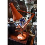 A HERBERT TERRY & SONS LTD ANGLEPOISE LAMP in orange