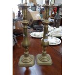 A LARGE PAIR OF VICTORIAN BRASS CANDLESTICKS