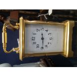 AN EDWARDIAN BRASS CASED CARRIAGE CLOCK