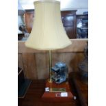 A VINTAGE TABLE LAMP with brass plaque, 'Farewell to an old timer' and mounted with an old