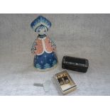 A VINTAGE TINPLATE CLOCKWORK TOY of a woman on wheels, a 19th century snuff box and a pair of