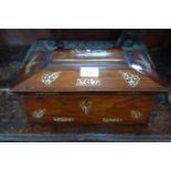 A 19TH CENTURY ROSEWOOD AND MOTHER OF PEARL INLAID TEA CADDY of sarcophagus form, 34cm wide