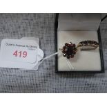 A FIVE STONE GARNET RING on a 9ct yellow gold shank, ring size R and one other similar ring, ring