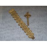 AN UNMARKED YELLOW METAL FILIGREE BRACELET with concealed clasp, together with a cross pendant (2)