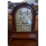AN EDWARDIAN MAHOGANY CASED BRACKET CLOCK with silvered dial, 38cm high