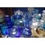 A COLLECTION OF BLUE GLASS, similar and a gilt chamberstick