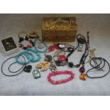 A COLLECTION OF JEWELLERY in a wooden casket