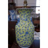 A PAIR OF TABLE LAMPS in the form of blue and yellow Oriental table lamps