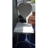 A VINTAGE FOLDING METAL GARDEN CHAIR with a heart shaped back, painted grey