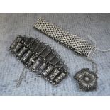 A SILVER GATE LINK BRACELET, one other white metal bracelet and a brooch (3)