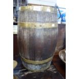 A BRASS BOUND OAK BUCKET with swing handle, 47cm high