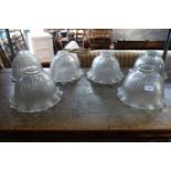 A SET OF SIX EARLY 20TH CENTURY FLUTED GLASS HANGING LAMP SHADES, 26.5cm dia.