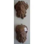 A PAIR OF CAST TERRACOTTA GARDEN MASKS of bearded satyrs, 24cm high (approx)