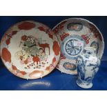 A JAPANESE DISH, decorated with musicians, 21cm dia., an Imari dish and a small Oriental blue and