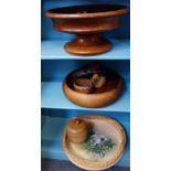 A TURNED WOODEN FOOTED BOWL and other items