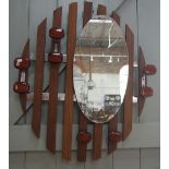 A FRENCH RETRO TEAK AND CHROME FRAMED COAT RACK with mirror, asymmetrically formed with cabochon