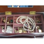 A COLLECTION OF COSTUME JEWELLERY AND WRISTWATCHES, in a fitted wooden jewellery box