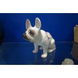AN EARLY 20TH CENTURY CONTINENTAL CERAMIC MATCHBOX HOLDER in the form of a French Bulldog, 17cm